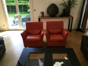 FAUTEUIL EN CUIR SECONDE MAIN HAUT DE GAMME QUALITE FABRICATION ITALIENNE ORANGE MEUBLES DUQUESNOY FRELINGHIEN ARMENTIERES HOUPLINES