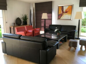 FAUTEUIL EN CUIR SECONDE MAIN HAUT DE GAMME QUALITE FABRICATION ITALIENNE ORANGE MEUBLES DUQUESNOY FRELINGHIEN ARMENTIERES HOUPLINES